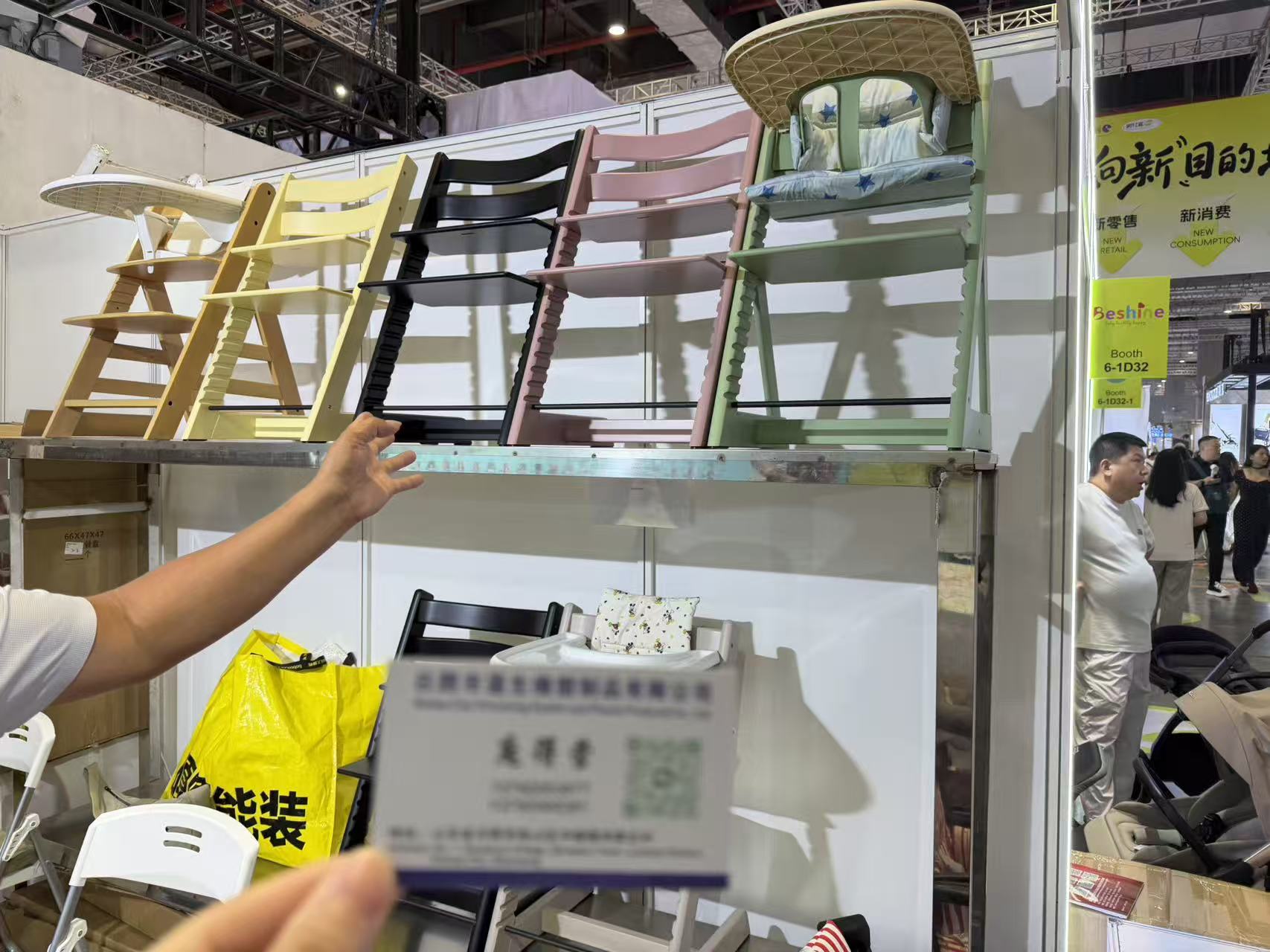 Baby high chairs displayed at a CBME supplier booth