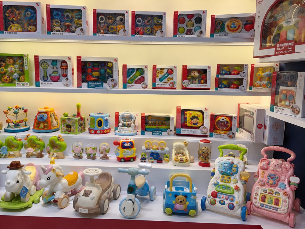 Baby activity toys, push toys and early learning products displayed in a supplier showroom