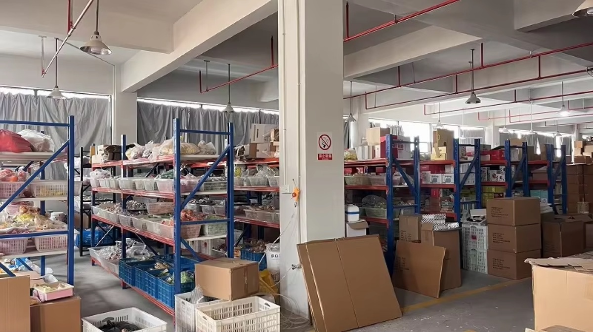 Toy order warehouse with shelves, cartons, and packing materials
